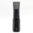Black hair clipper with 'Groomaster' branding on a white background