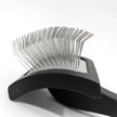 Pet grooming brush with metal bristles on a white background