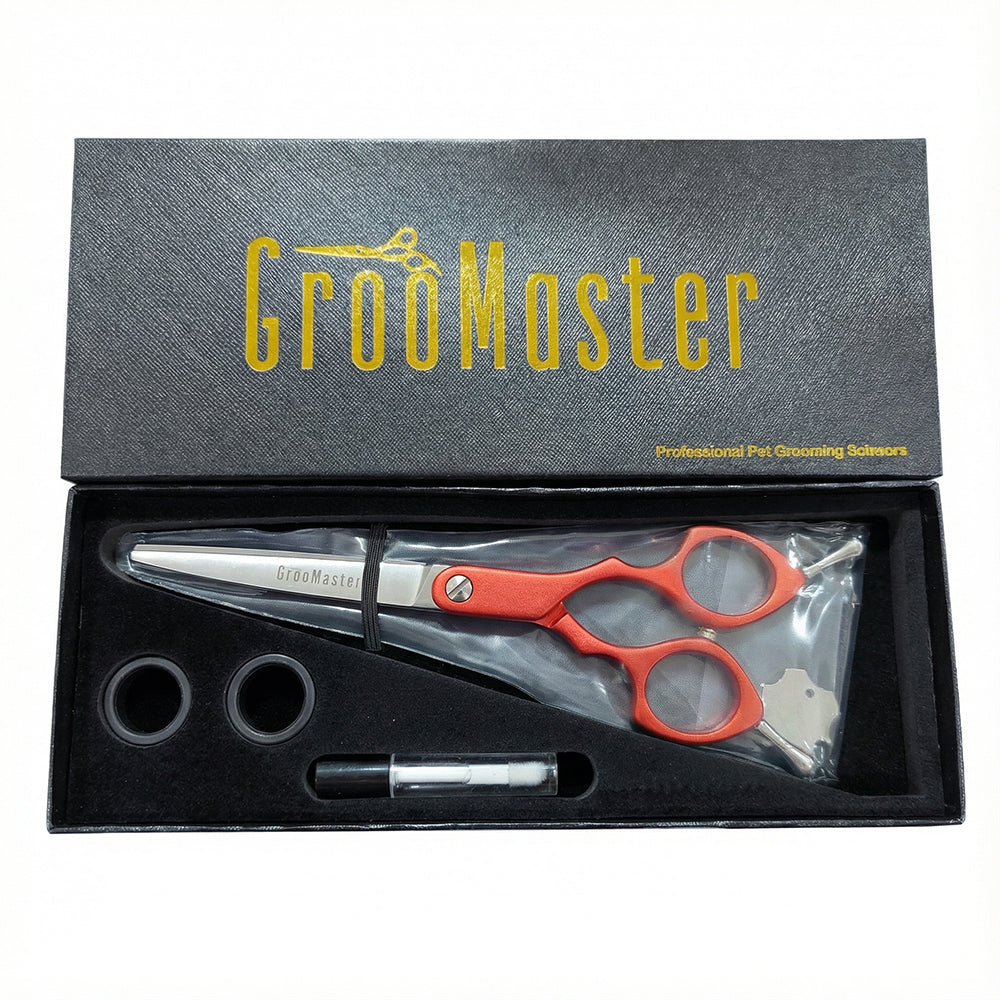 Groomaster professional pet grooming shears set in a black box with gold text.